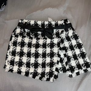 Black and white checkered skort. BRAND NEW NEVER WORN